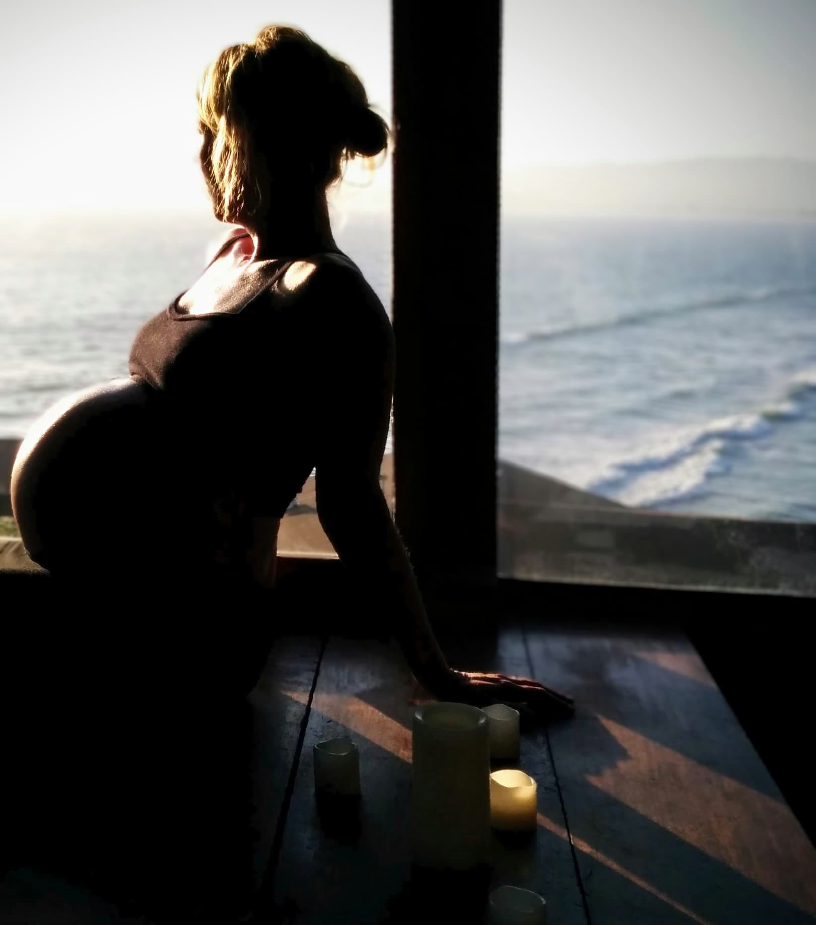 Pregnant woman holding her belly